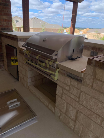 Custom outdoor kitchen with built-in grill